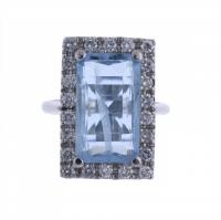 73-LARGE RING WITH BLUE TOPAZ AND DIAMONDS.