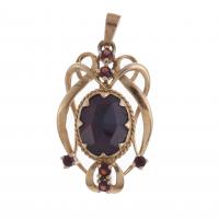 186-MODERNIST STYLE PENDANT WITH GARNETS.