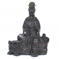 214-20TH CENTURY CHINESE SCHOOL. "GUANYIN ON A FOO DOG".