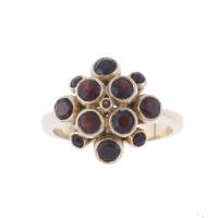 9-RING WITH GARNETS ROSETTE.