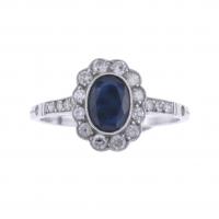 13-ROSETTE RING WITH SAPPHIRE.