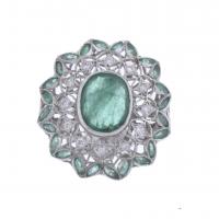 36-ROSETTE RING WITH DIAMONDS AND EMERALDS.