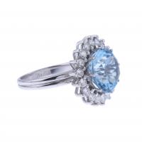 76-ROSETTE RING WITH BLUE TOPAZ AND DIAMONDS.