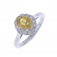 18-ROSETTE RING WITH A YELLOW SAPPHIRE AND DIAMONDS.