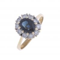 16-ROSETTE RING WITH SAPPHIRE AND DIAMONDS.