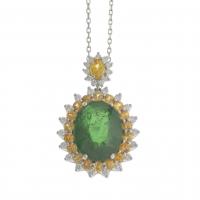 111-PENDANT WITH A LARGE EMERALD BORDERED WITH YELLOW SAPPHIRES AND DIAMONDS.