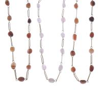25808-THREE LONG NECKLACES WITH AGATES.