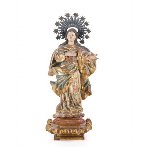 Sculpture in carved wood, polychrome and decorated with "estofado" technique. It has some faults and cracks.70 x 27 x 20 cms.