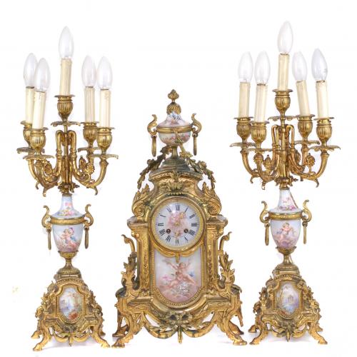 ORNATE BARCELONA CLOCK AND PAIR OF CANDELABRAS. FIRST DECADES C20th