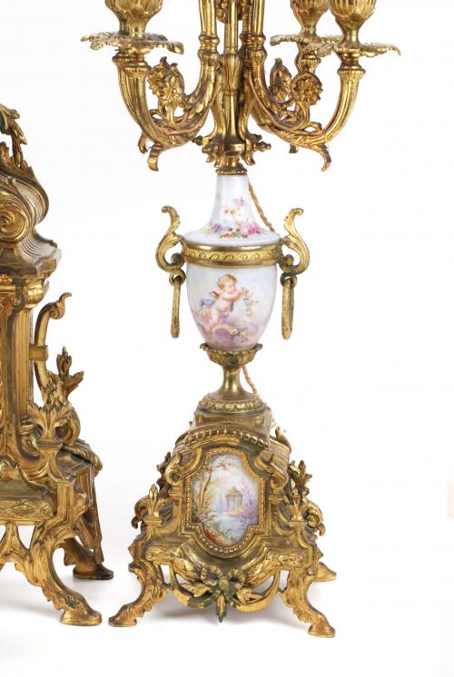 ORNATE BARCELONA CLOCK AND PAIR OF CANDELABRAS. FIRST DECAD