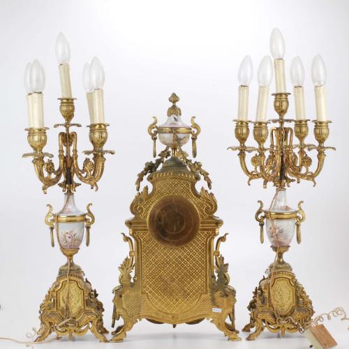 ORNATE BARCELONA CLOCK AND PAIR OF CANDELABRAS. FIRST DECAD