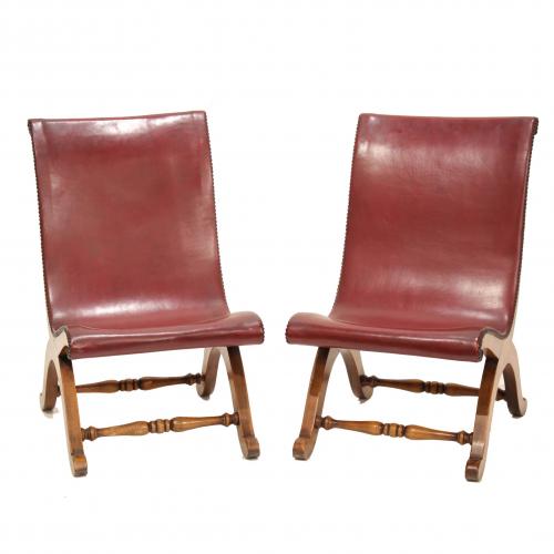 Beech wood, leather and brass. Designed by Pierre Lottier for Valenti. Stamped on the legs.Minimal marks on the leather.78 x 48 x 56 cm.