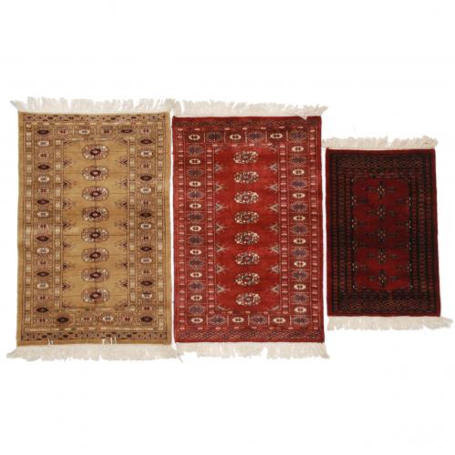 THREE SMALL PAKISTANI CARPETS, C20th.