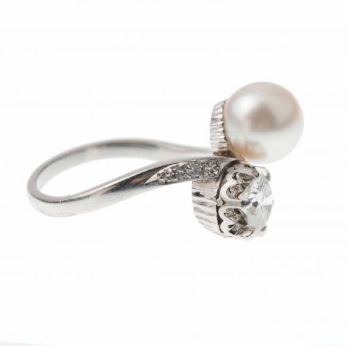 YOU AND ME RING WITH A PEARL AND A DIAMOND.