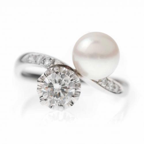 YOU AND ME RING WITH A PEARL AND A DIAMOND.