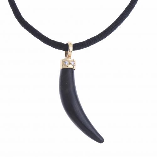 NECKLACE WITH HORN PENDANT IN EBONY AND DIAMONDS.