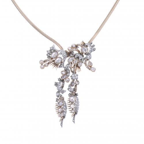 FLORAL PENDANT-BROOCH WITH GOLD AND DIAMONDS NECKLACE.