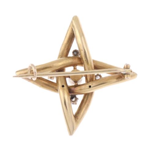 STAR-SHAPED BROOCH IN YELLOW GOLD AND DIAMONDS.