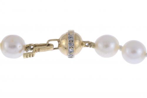 Collar de perlas.