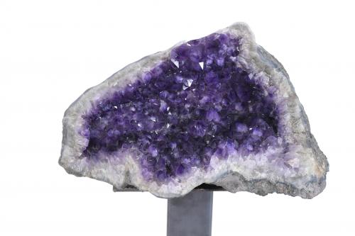 LARGE AMETHYST GEODE ON A PEDESTAL.