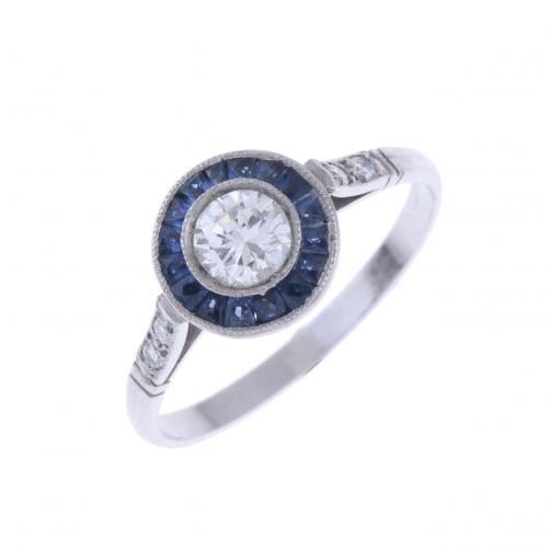 ART DECO BIRD'S EYE RING WITH DIAMONDS AND SAPPHIRES.