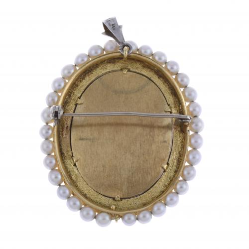 BROCHE-COLGANTE OVAL CON BUSTO MUJER.
