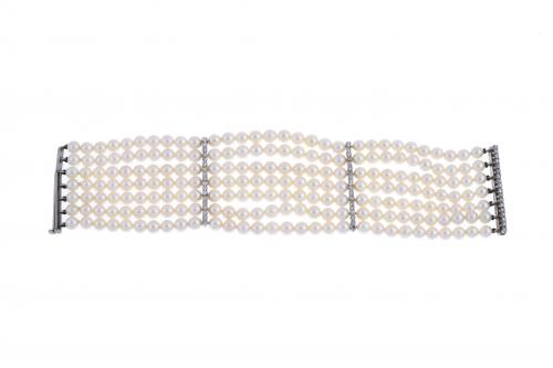 PULSERA ANCHA DE PERLAS Y DIAMANTES.