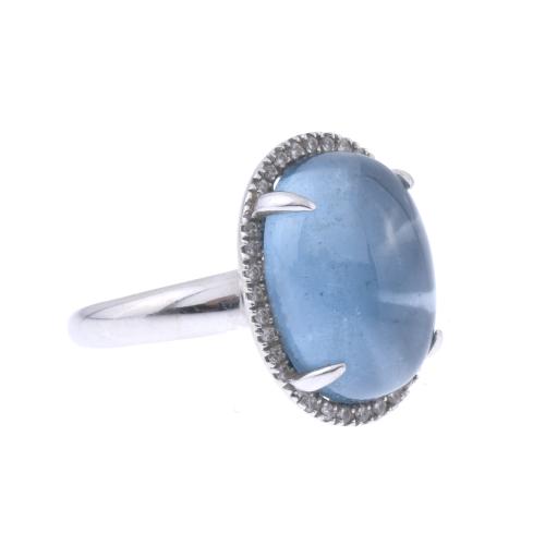 RING WITH BLUE TOPAZ AND DIAMONDS.