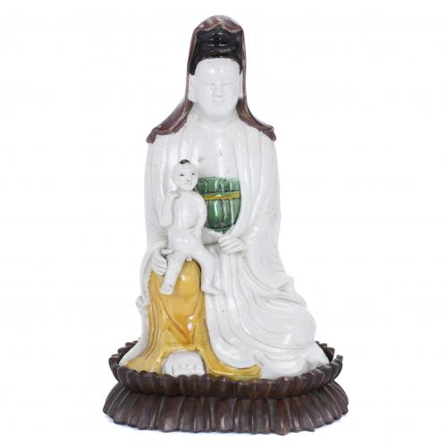 GUANYIN FIGURE WITH A CHILD, 20TH CENTURY.