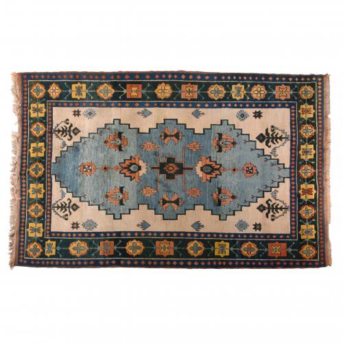 IRANIAN BLUE-GREEN AND BEIGE CARPET, 20TH CENTURY.