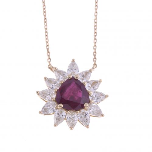 RUBY AND DIAMONDS ROSETTE PENDANT.