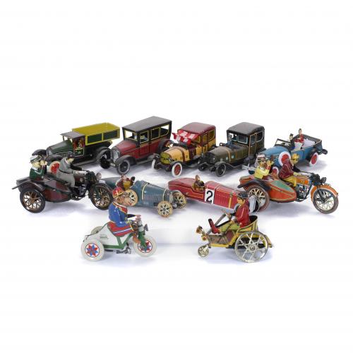 COLLECTION OF ELEVEN TIN VEHICLES, 20TH CENTURY.