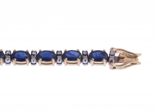 RIVIÈRE BRACELET WITH SAPPHIRES AND DIAMONDS.