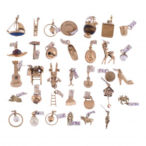 SET OF THIRTY-FOUR CHARMS.