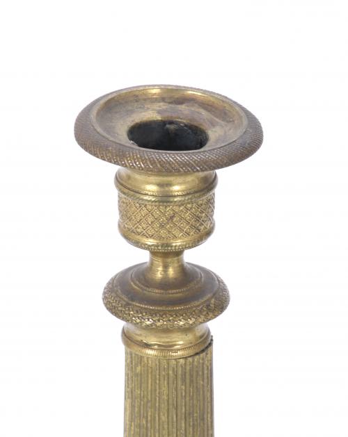 PAIR OF CHARLES X PERIOD GILDED BRONZE CANDLESTICKS.