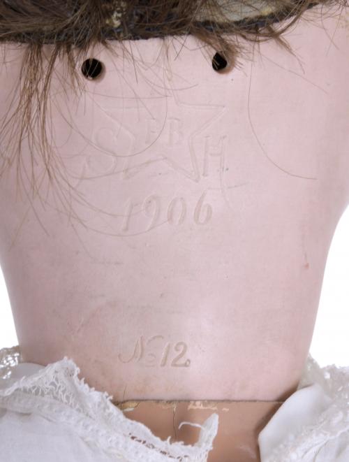 GERMAN PORCELAIN DOLL, 1906.