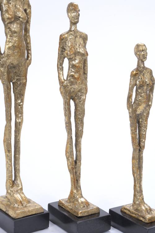THREE FIGURES AFTER MODELS BY GIACOMETTI.