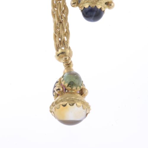 LONG NECKLACE WITH CORD AND GEMSTONES CABOCHONS.