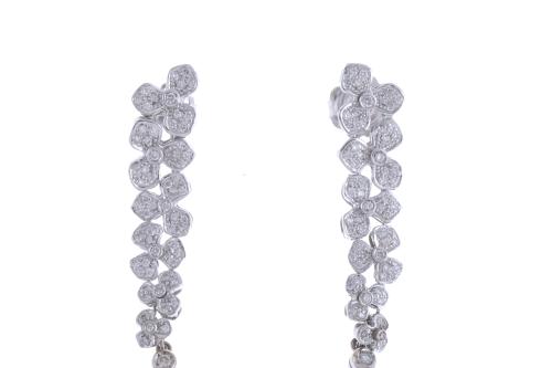 LONG FLORAL EARRINGS WITH DIAMONDS AND CORAL TEARDROP.