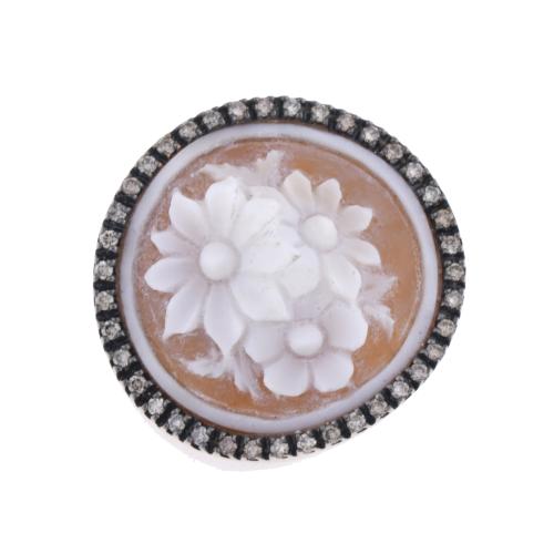 Carved shell ring with flowers.