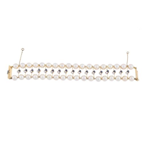 Two-row pearls bracelet with sapphires and diamonds.