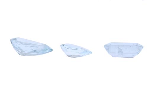 Set of three unmounted aquamarines.