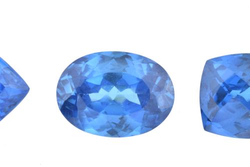 Set of three unmounted London blue topazes.