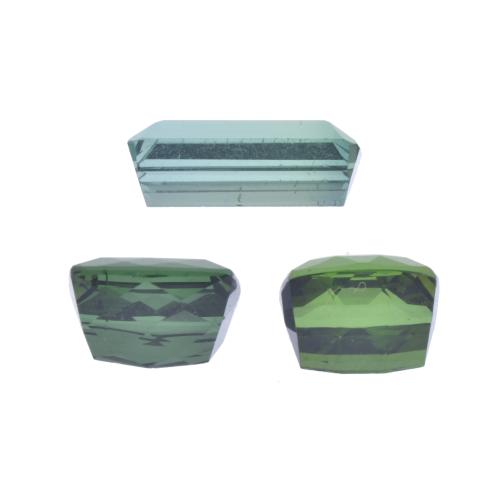 Lot of three unmounted green tourmalines.