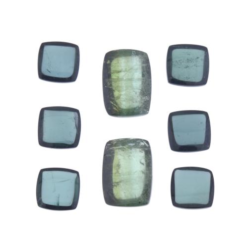 Lot of eight unmounted green tourmalines.