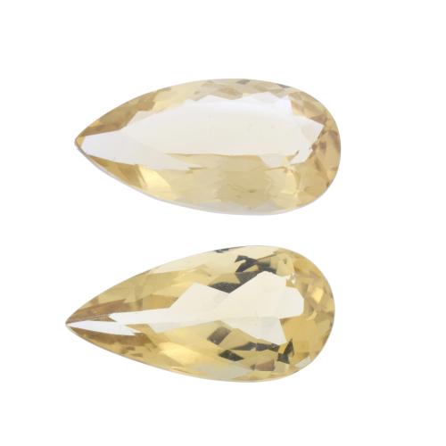 Pair of unmounted pear cut citrines of 24.6 ct and 23.9 ct.