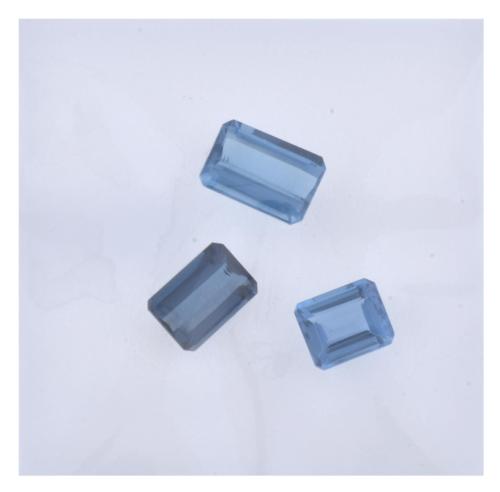 Set of three unmounted London Blue topazes, 12.90 ct. total.
