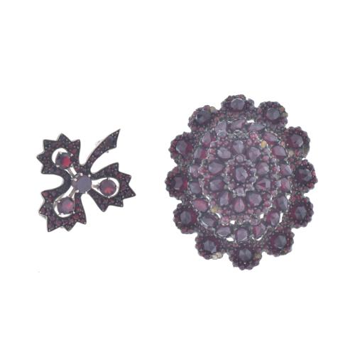 Floral locket brooch with garnets and leaf-shaped brooch with garnets.