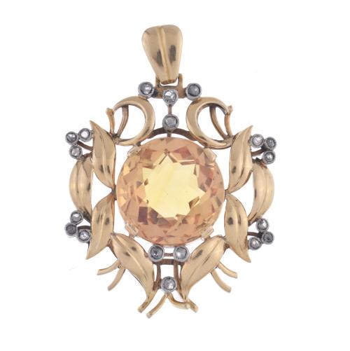 Pendant with large citrine and floral motifs.
