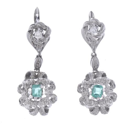 Emeralds and diamonds floral earrings.
